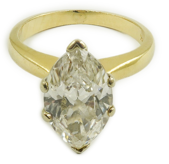 A modern 14k gold and solitaire marquise diamond set ring